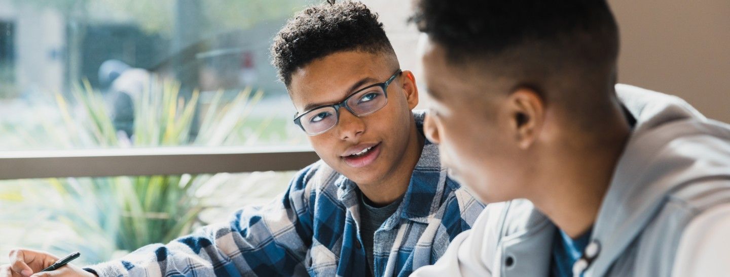 Male students classrom working studying together