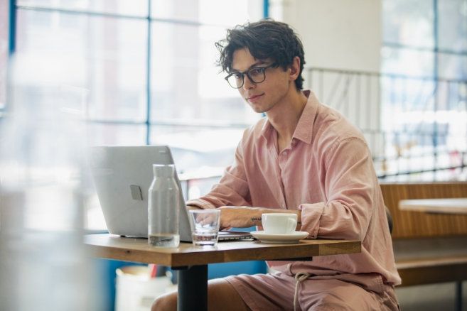 Male working cafe happy