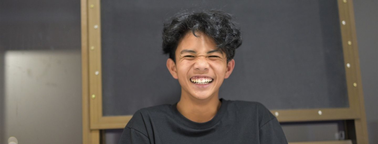 Student happy smiling indoors
