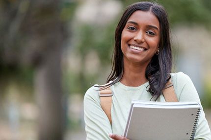Student happy smiling outside campus
