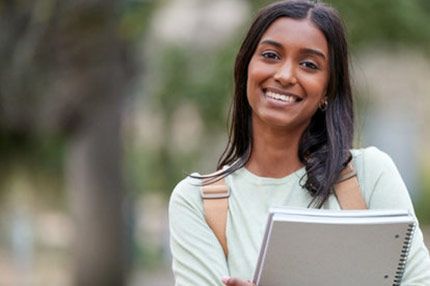 Student happy smiling outside campus
