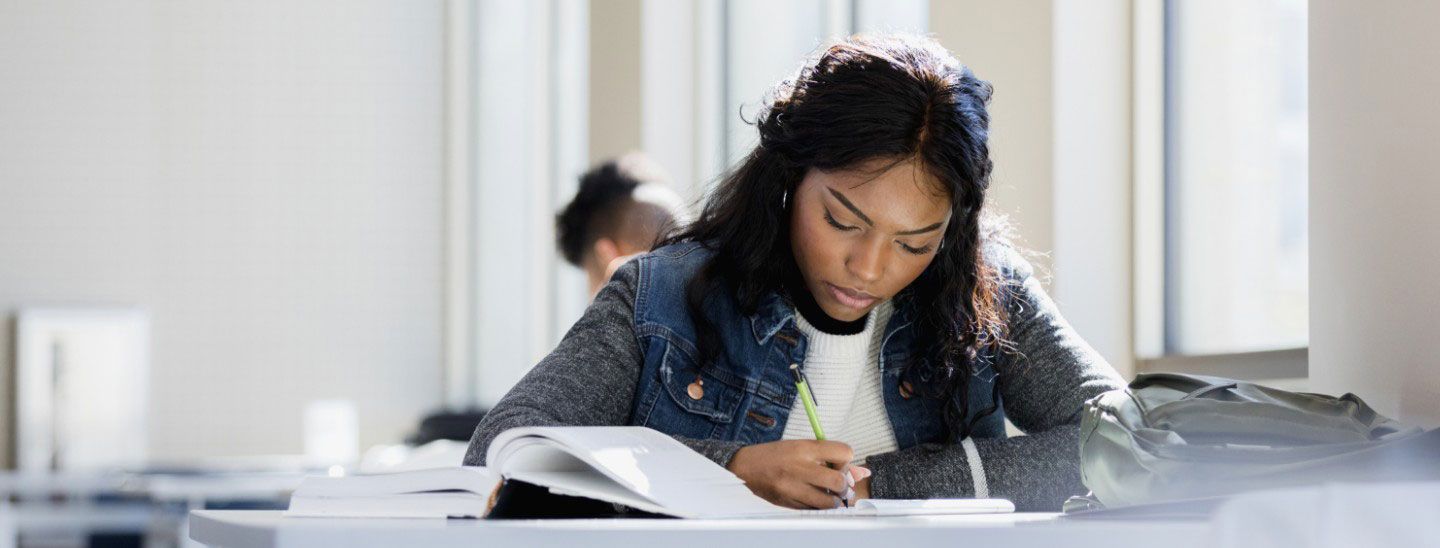 Student studying working classroom