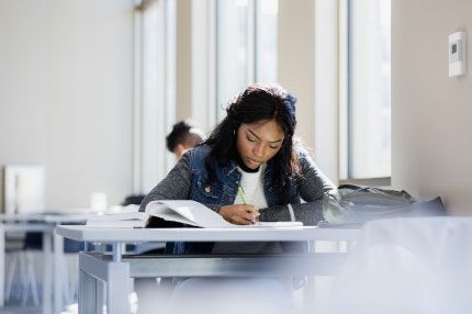 Student studying working classroom