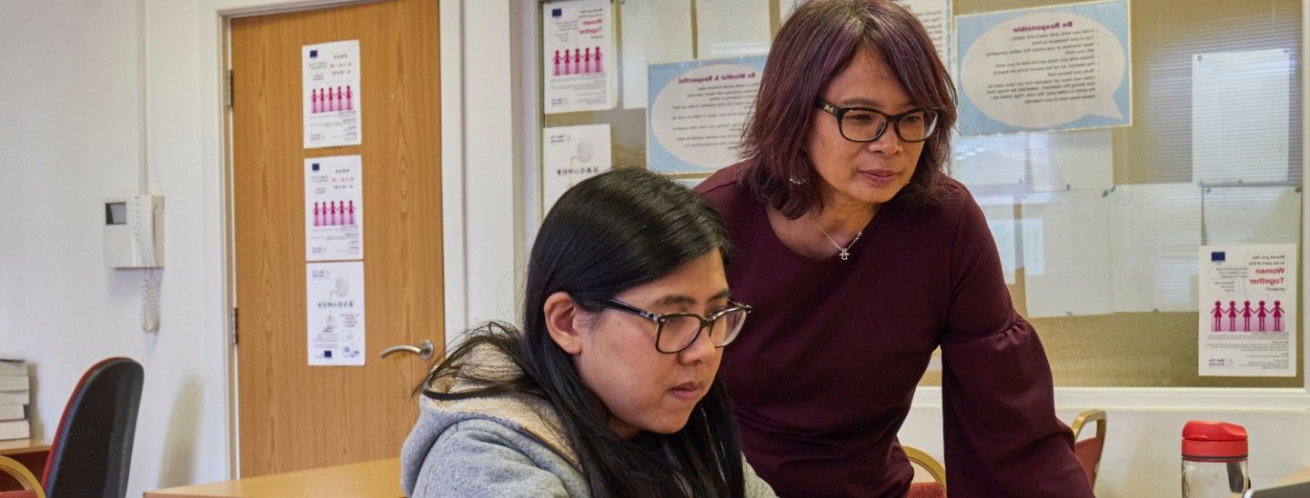 Student teacher helping working together