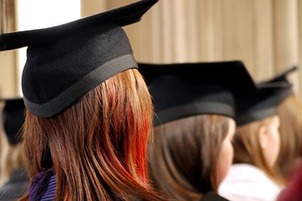 Students graduation cap campus