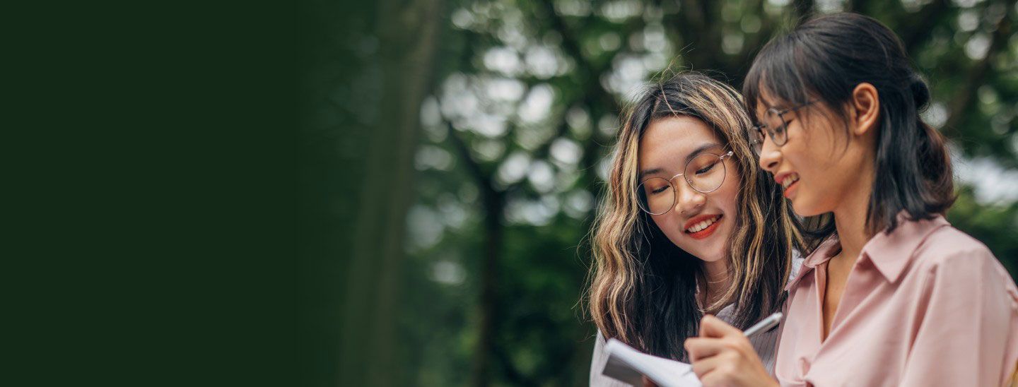 Students happy studying together outside working