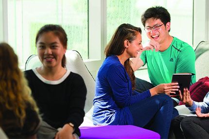 Students on campus socialising studying