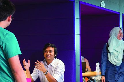 Students on campus walking speaking