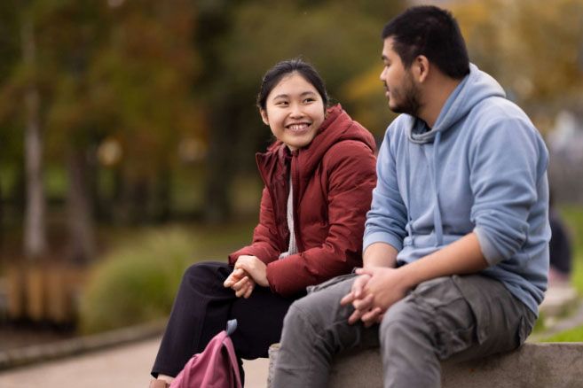Students outside laughing